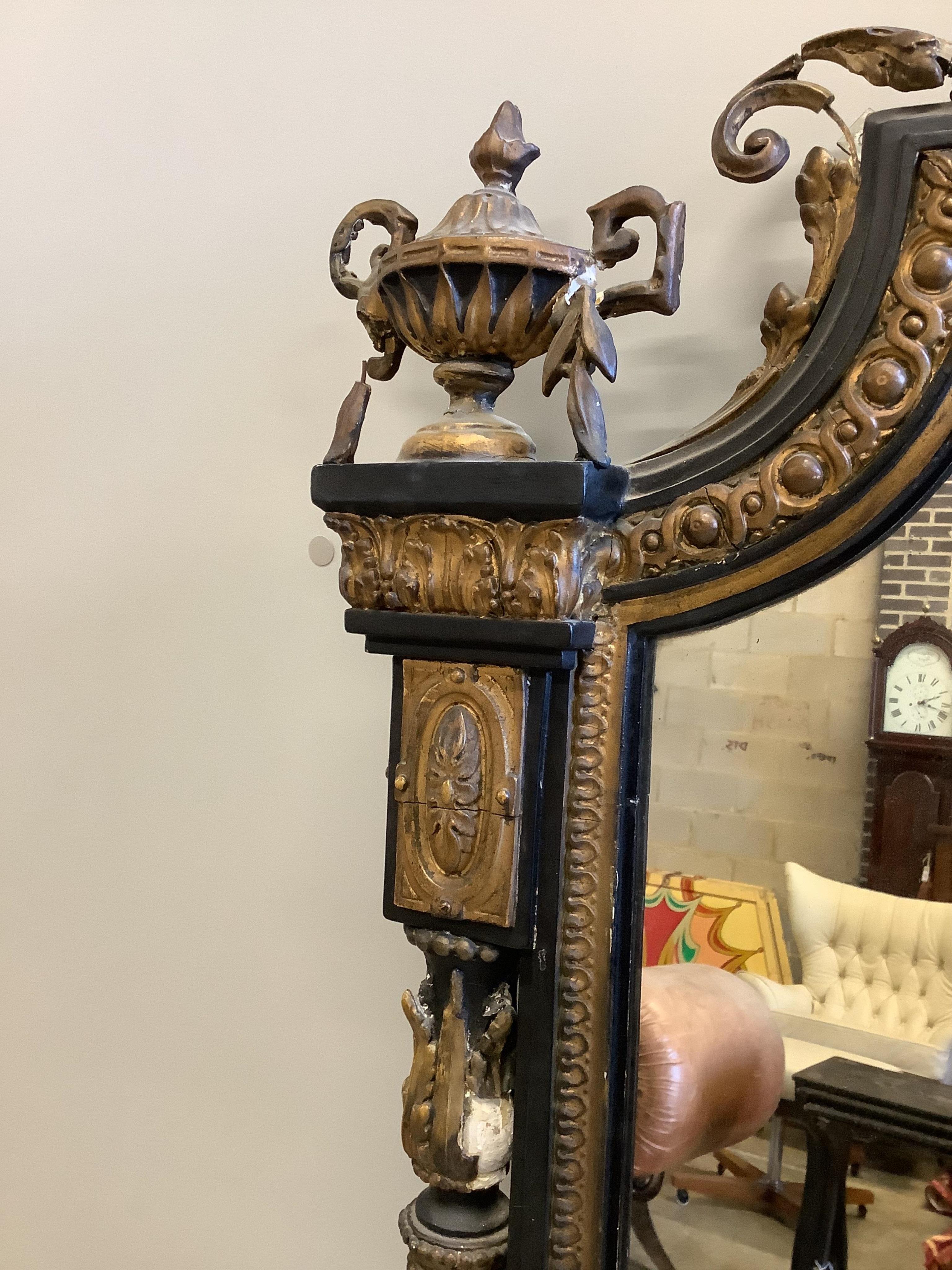 A large Victorian Rococo style giltwood and composition overmantel mirror, width 152cm, height 178cm. Condition - poor to fair